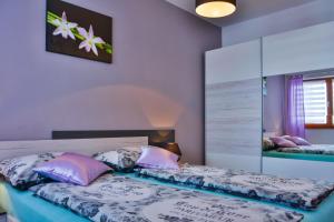 Posteľ alebo postele v izbe v ubytovaní Apartment Klaudio