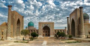 a large building with two domes and a mosque at World Guest House in Samarkand