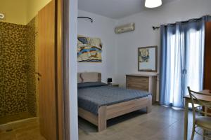 Postelja oz. postelje v sobi nastanitve Kafouros Hotel