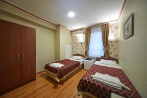 
Un ou plusieurs lits dans un hébergement de l'établissement Hotel Akcinar
