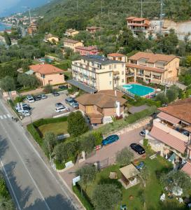 an aerial view of a village with houses and a road at Residence Rosemary in Brenzone sul Garda