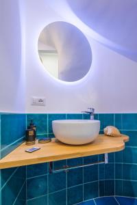 a bathroom with a sink and a mirror at Sapore di Sale in Atrani