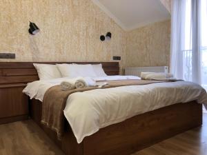 Postel nebo postele na pokoji v ubytování Toliketi Kazbegi