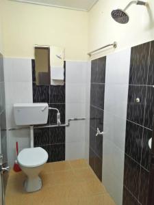 Ванная комната в Homestay / Roomstay Muslim Budget Tanjung Malim