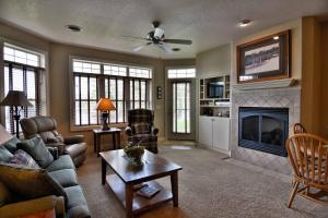 a living room with a couch and a fireplace at Unit 411A 1 Bd 1 Ba Condo Condo in Birchwood