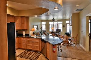 a kitchen and dining room with a table and chairs at Unit 411A 1 Bd 1 Ba Condo Condo in Birchwood