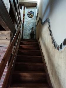 a staircase in a building with a painting on the wall at CAL PINTOR in Ibars de Noguera