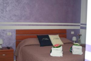 Postel nebo postele na pokoji v ubytování I Villini Affittacamere