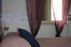Postel nebo postele na pokoji v ubytování I Villini Affittacamere