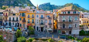 a view of a city with buildings at Taormina Bedda Rooms in Taormina