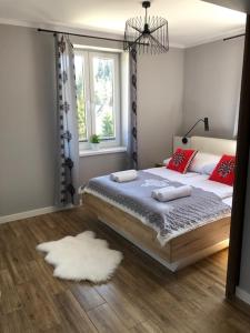 Posteľ alebo postele v izbe v ubytovaní Pałac Tatrzański-Apartament 206
