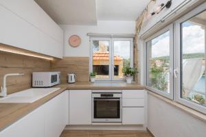 Kuchyňa alebo kuchynka v ubytovaní Apartments Habek