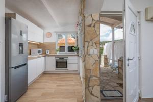 Kuchyňa alebo kuchynka v ubytovaní Apartments Habek