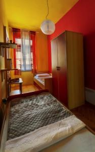 a small room with a bed and a cabinet at Apartman Sandra in Pula