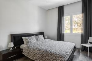 Postel nebo postele na pokoji v ubytování Cozy Apartment in City Center