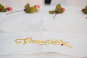 a group of butterflies sitting on top of a table at Samalá Casa Hotel in Pitalito