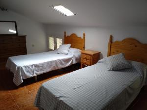 Un pat sau paturi într-o cameră la LOS CALLEJONES