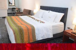 Postel nebo postele na pokoji v ubytování Samalá Casa Hotel