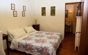 a bedroom with a bed with a quilt on it at B&B Il Bijou in Casalmaggiore