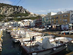 a bunch of boats are docked in a harbor at Casa Vacanza Anacapri Sunrise in Anacapri