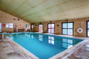 a large indoor swimming pool in a building at Debbie's Den in Dillon