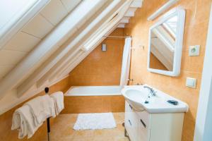 a bathroom with a sink and a bath tub at Casa Dos Barcos Furnas in Furnas +18 photos