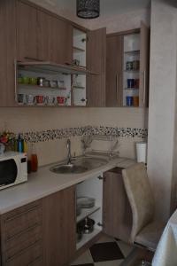 Kuchyň nebo kuchyňský kout v ubytování Relax Apartment