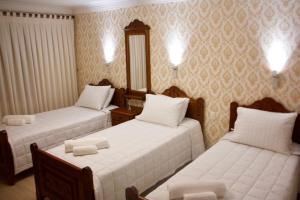 Una cama o camas en una habitación de Hotel Staufenberg