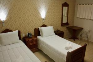 Una cama o camas en una habitación de Hotel Staufenberg