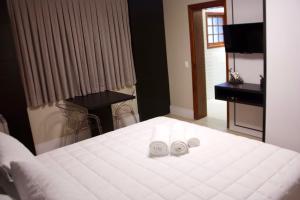Una cama o camas en una habitación de Hotel Staufenberg