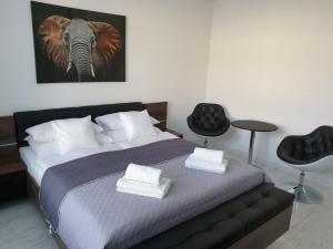 Posteľ alebo postele v izbe v ubytovaní Apartmány Urban