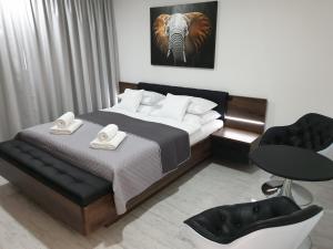 Posteľ alebo postele v izbe v ubytovaní Apartmány Urban