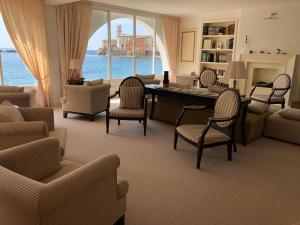 a living room with a table and chairs at Hotel Miramare & Spa in Sestri Levante