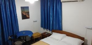 A bed or beds in a room at San Georgio Hotel