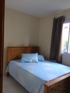En eller flere senge i et værelse på Apto Porto de Galinhas