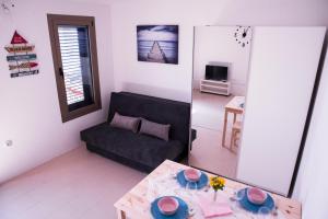 TV a/nebo společenská místnost v ubytování Apartments Svijet Mora 2