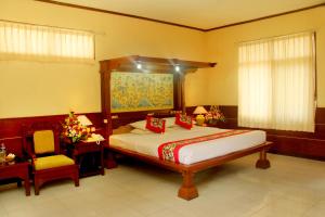 Postel nebo postele na pokoji v ubytování Melasti Beach Resort & Spa Legian