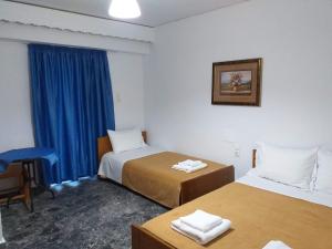A bed or beds in a room at San Georgio Hotel