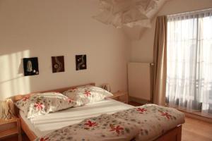 A bed or beds in a room at Tatry Fimali