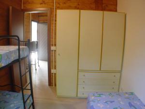 Postel nebo postele na pokoji v ubytování Camping Luni