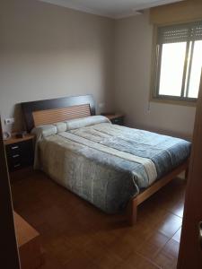 Postel nebo postele na pokoji v ubytování Casa del Abuelo Ferrol