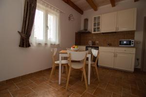 Kuchyň nebo kuchyňský kout v ubytování Residence Mama