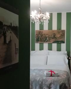 a bedroom with a bed with a red bow on it at B&B L'Albero Di Antonia in Atri