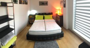 Ένα ή περισσότερα κρεβάτια σε δωμάτιο στο RELAX Cluj Apartment Terrace & City View