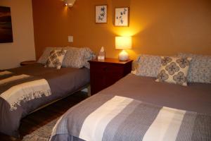 A bed or beds in a room at Mancos Inn
