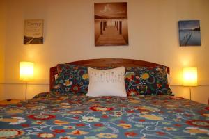 A bed or beds in a room at Mancos Inn