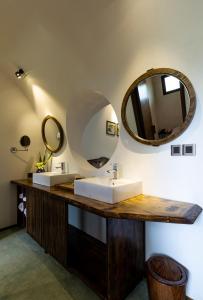 
a bathroom with a sink and a mirror at Hoi An Trails Resort & Spa in Hoi An

