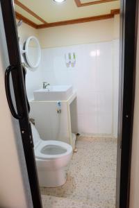 a bathroom with a toilet and a sink at Phi Phi Sand Sea View Resort in Phi Phi Islands