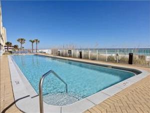 a large swimming pool with a blue water at Ocean Reef 2 bedroom/2 bath! in Panama City Beach