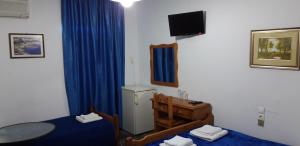 A television and/or entertainment centre at San Georgio Hotel